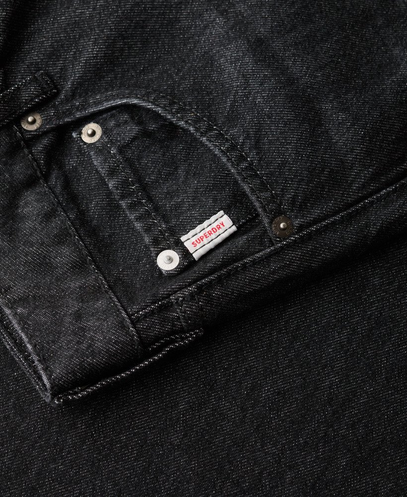 calça jeans de algodão orgânico de perna larga na cor wolcott black stone