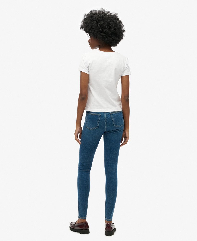 calça jeans skinny de cintura alta em algodão orgânico na cor azul vintage fulton.