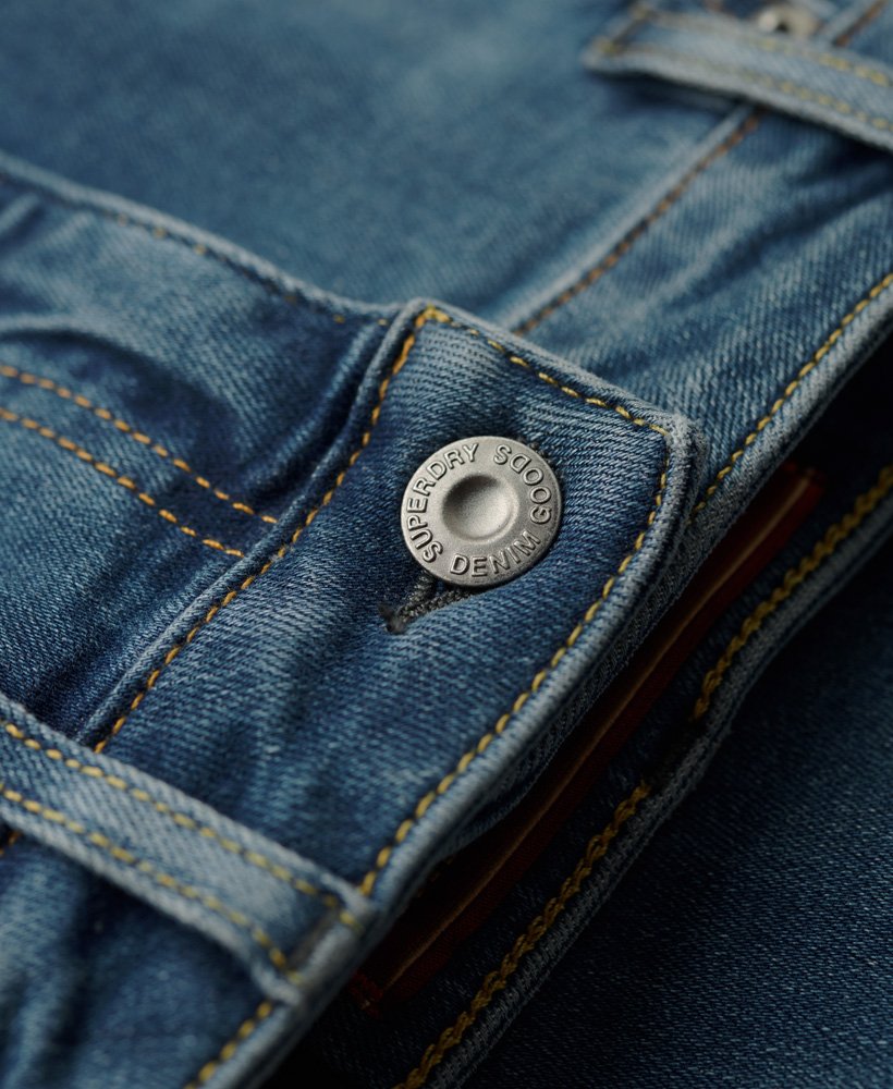 calça jeans skinny vintage de algodão orgânico com cintura média na cor azul vintage fulton.