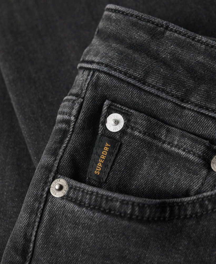 calça jeans skinny vintage de algodão orgânico com cintura média na cor walcott black stone.