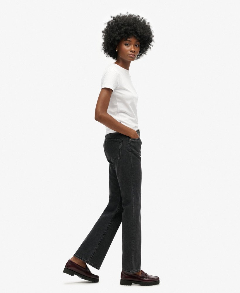 calça jeans vintage de cintura média e modelagem flare slim na cor walcott black stone.