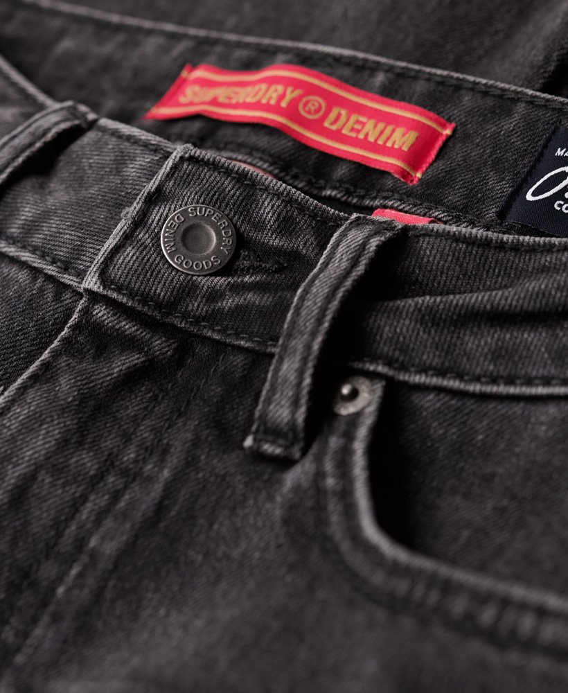 calça jeans vintage de cintura média e modelagem flare slim na cor walcott black stone.