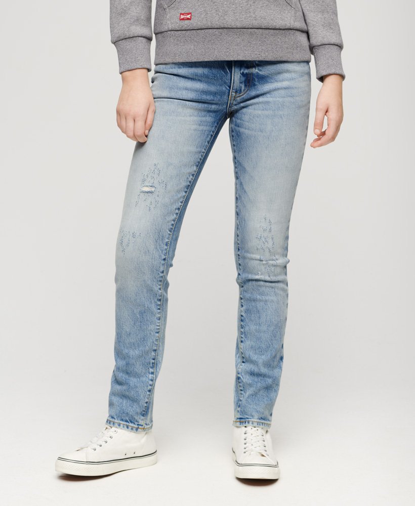 calça jeans slim de cintura média em algodão orgânico na cor azul cânion.