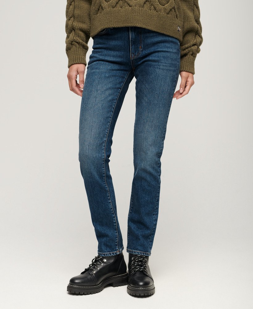 calça jeans slim de cintura média em algodão orgânico na cor azul valley.