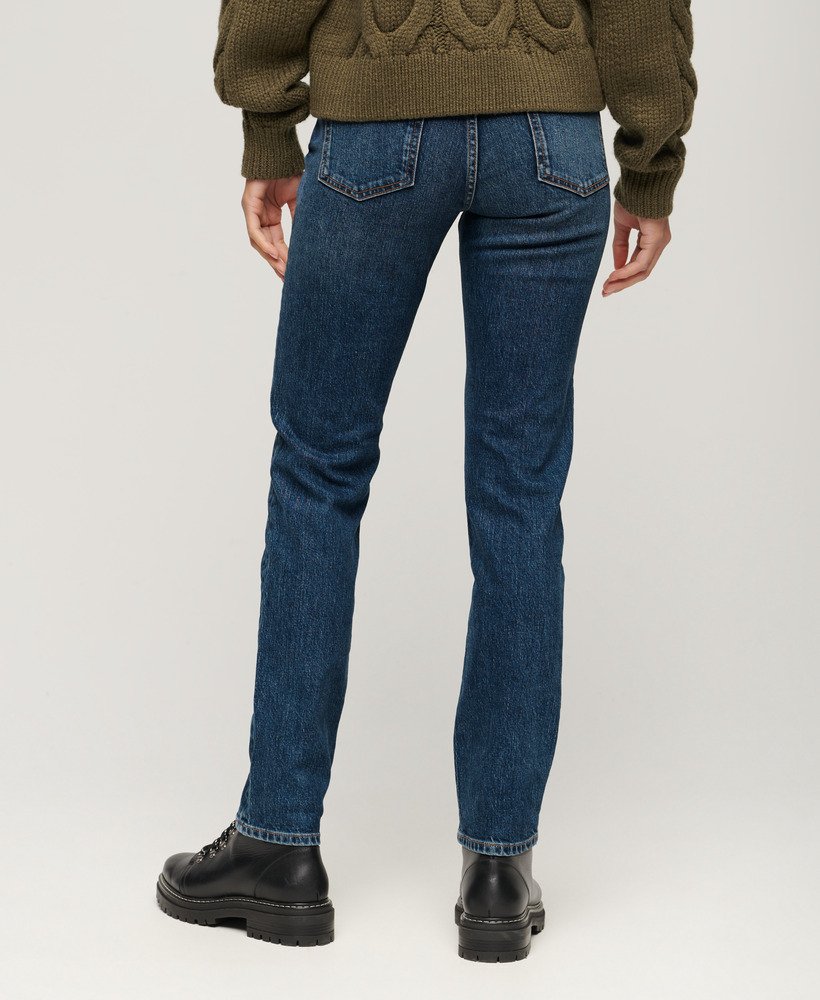 calça jeans slim de cintura média em algodão orgânico na cor azul valley.