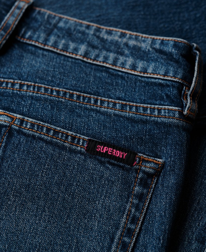 calça jeans slim de cintura média em algodão orgânico na cor azul valley.