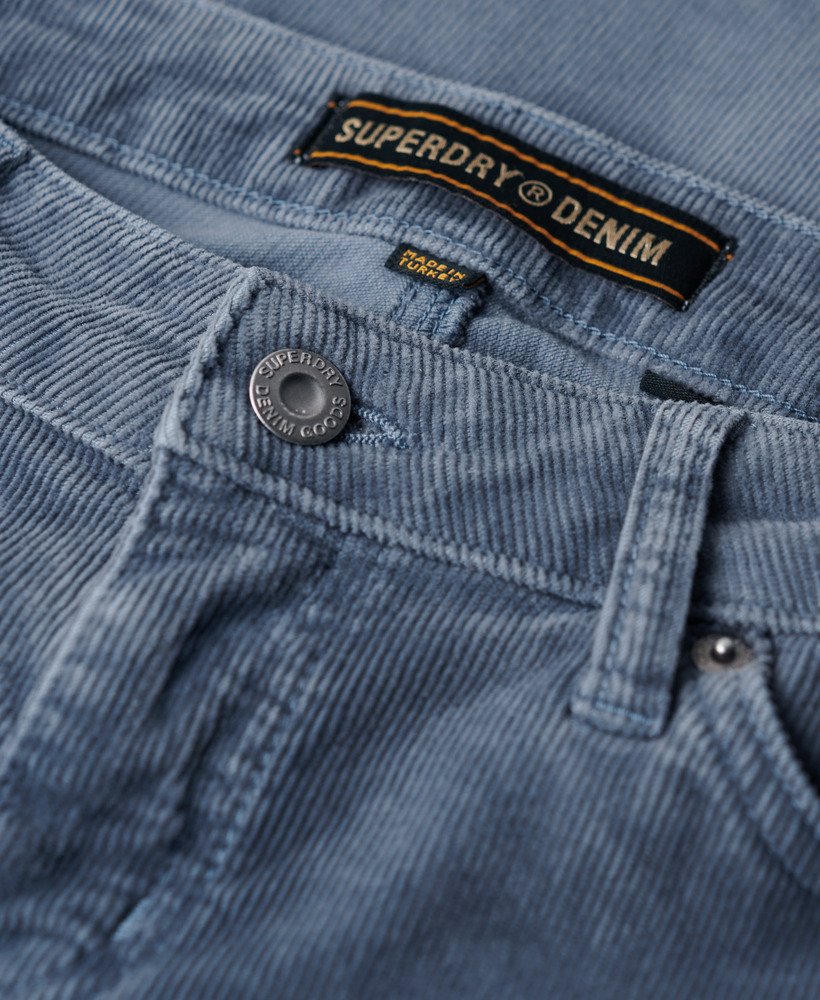 calça jeans flare de cintura baixa em veludo cotelê azul lavado