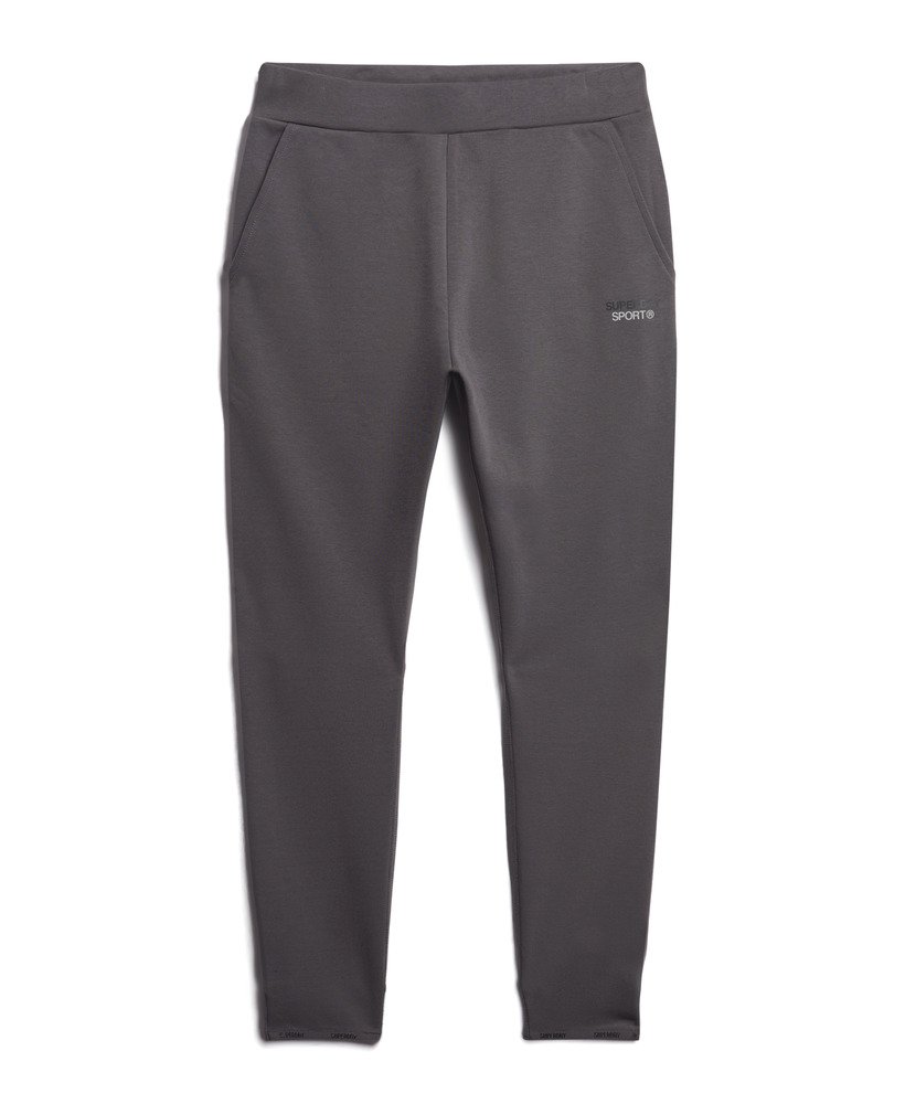 calça de moletom sport tech tapered na cor cinza escuro.