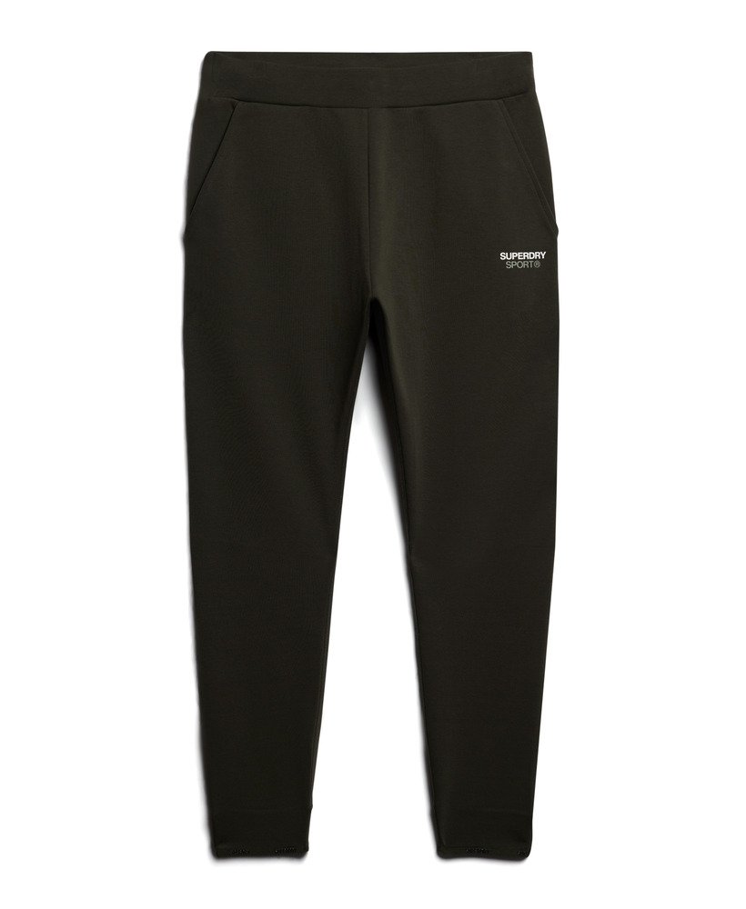 calças de corrida sport tech tapered na cor cáqui militar.
