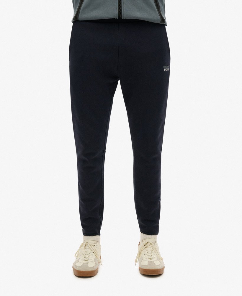calça de moletom sport tech logo tapered na cor azul marinho eclipse