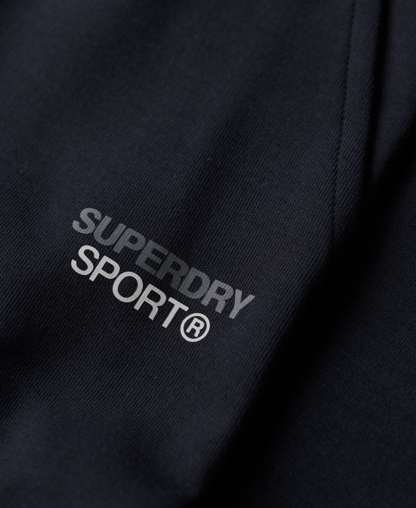 calça de moletom sport tech logo tapered na cor azul marinho eclipse