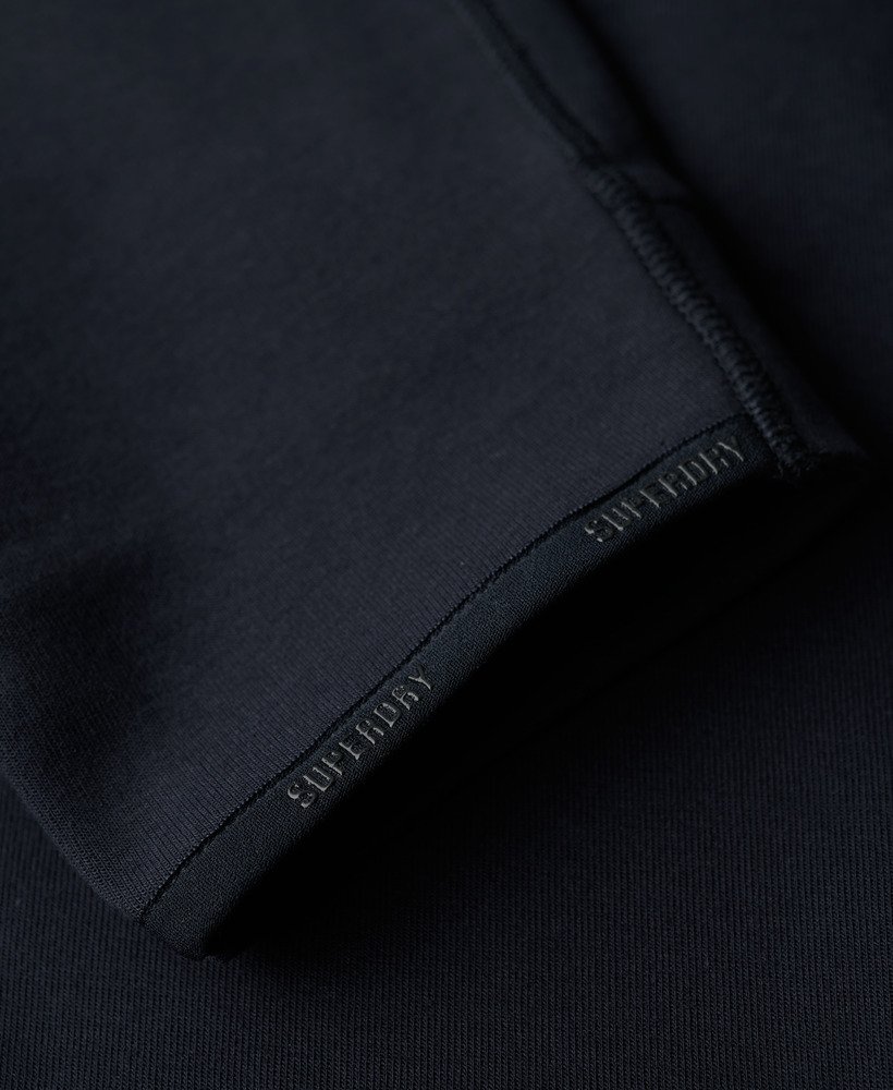 calça de moletom sport tech logo tapered na cor azul marinho eclipse