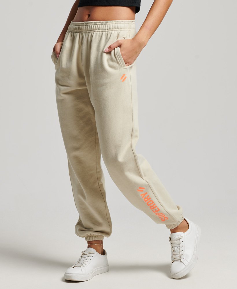 calça de treino core sports na cor bege pelicano