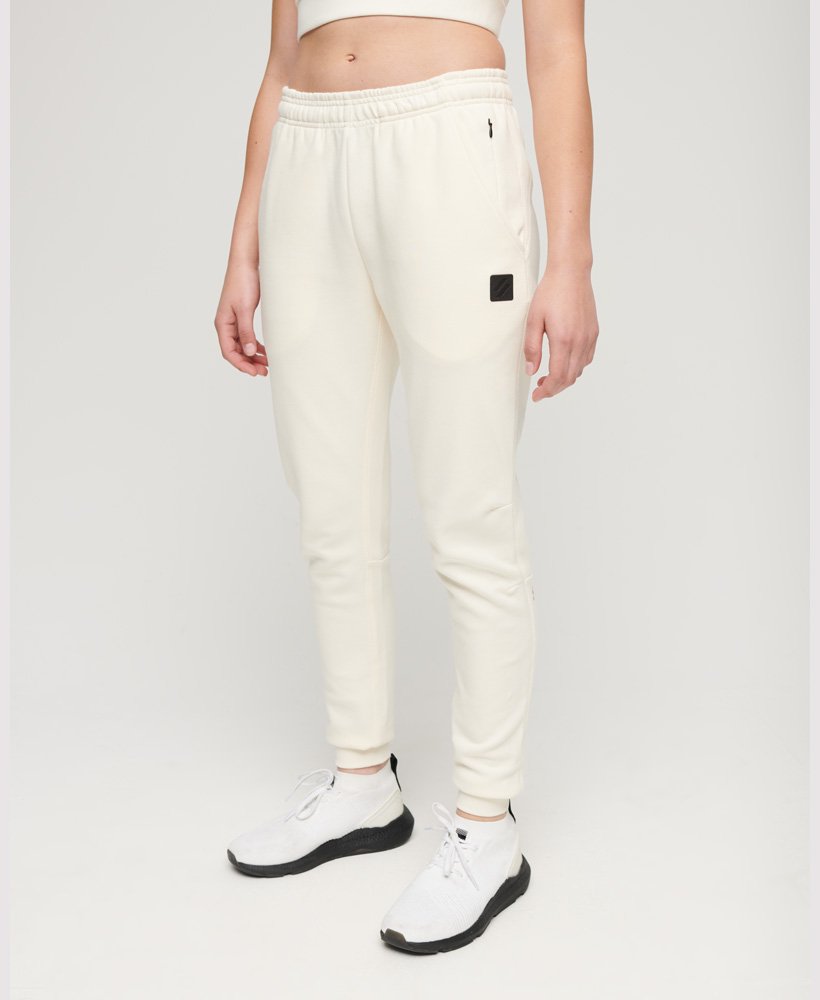 calça jogger slim da code tech na cor branco arroz