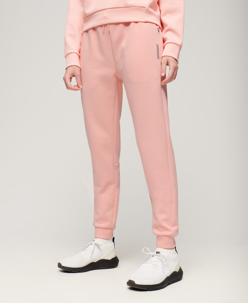 calça de moletom sports tech slim na cor rosa pêssego perolado