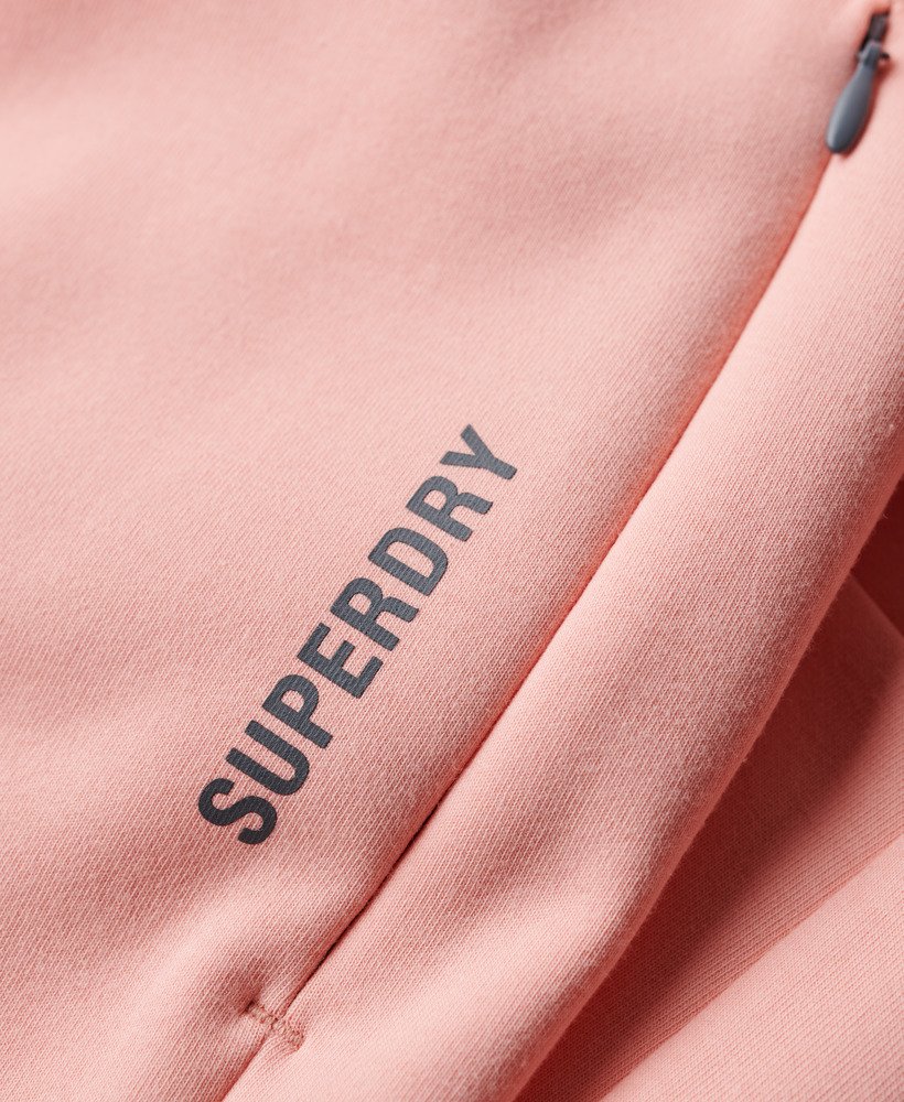 calça de moletom sports tech slim na cor rosa pêssego perolado