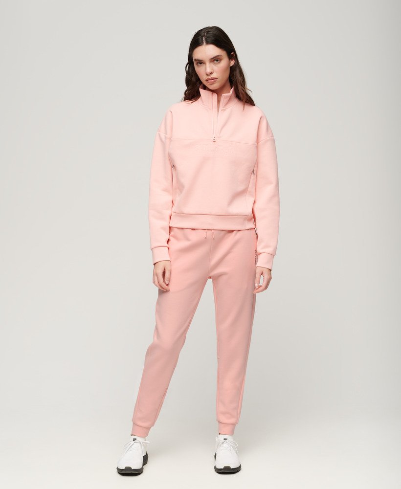 calça de moletom sports tech slim na cor rosa pêssego perolado