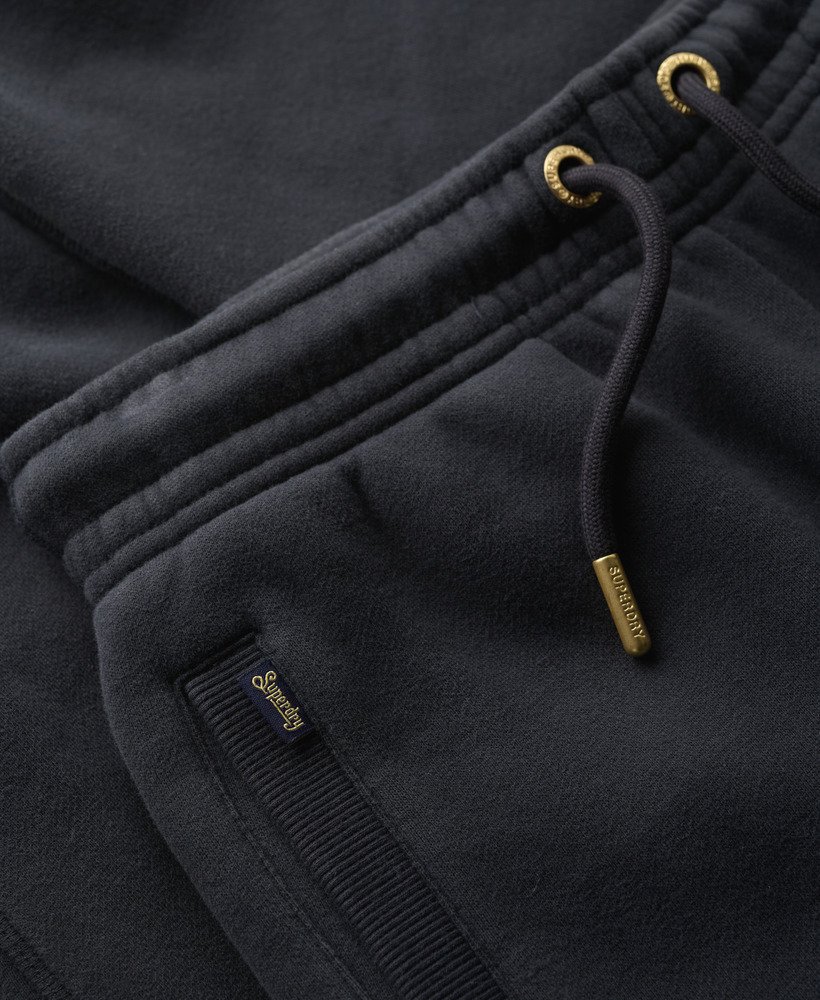 calça jogger essential logo com punho na cor azul marinho mais intenso