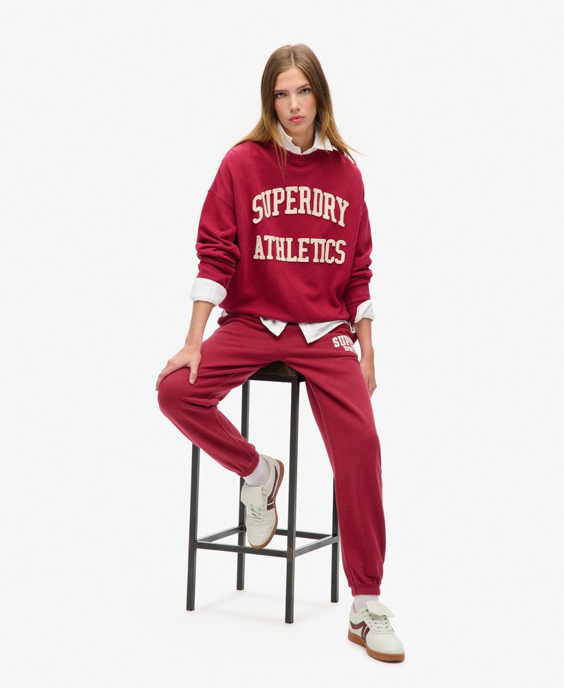 calça jogger boyfriend athletic essentials na cor vermelho bordô