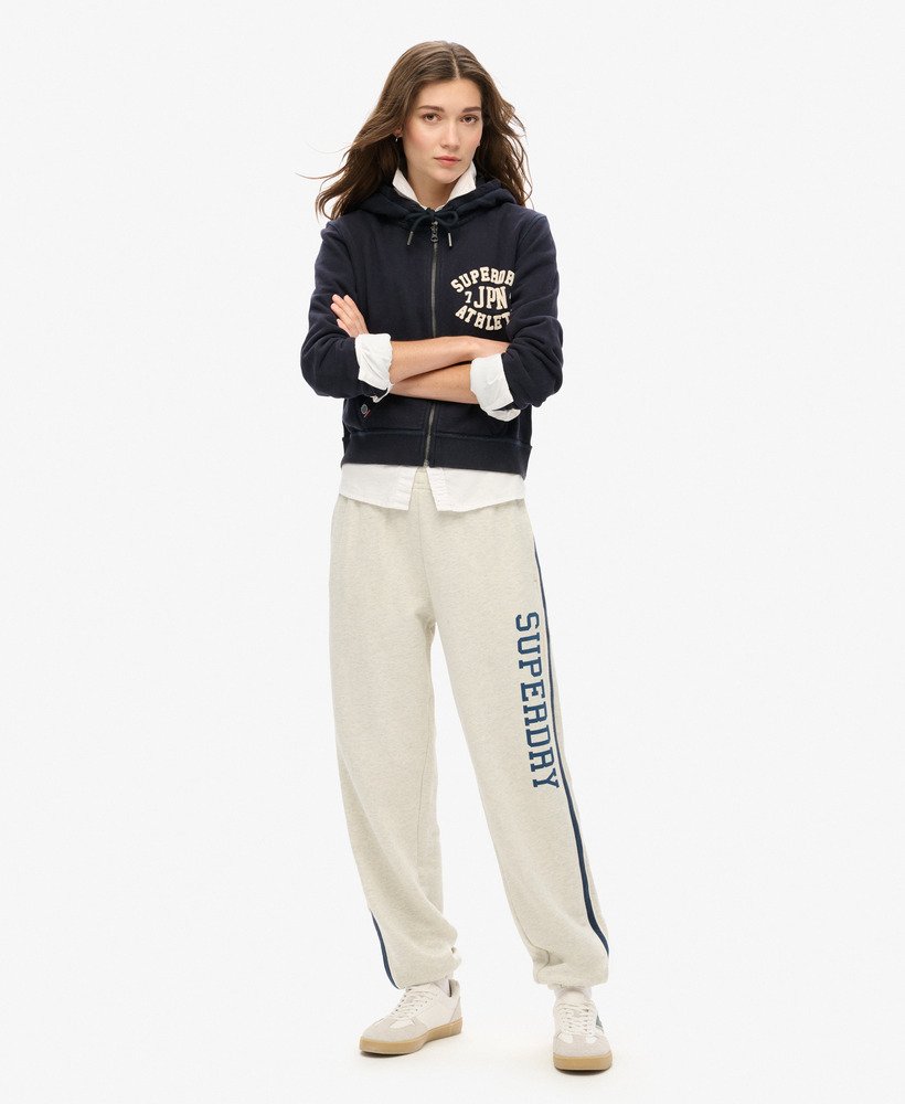 calça de moletom athletic essentials vintage com listras laterais na cor cinza mesclado aveia