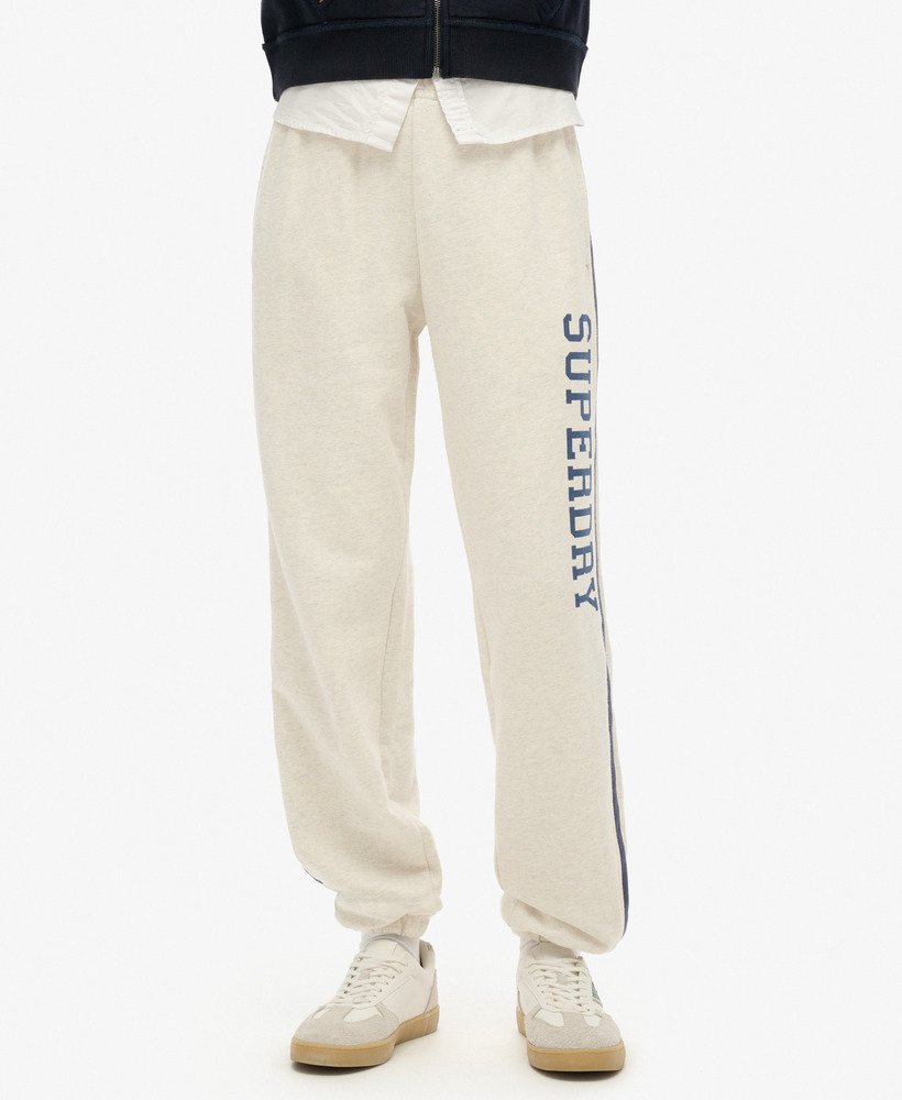 calça de moletom athletic essentials vintage com listras laterais na cor cinza mesclado aveia