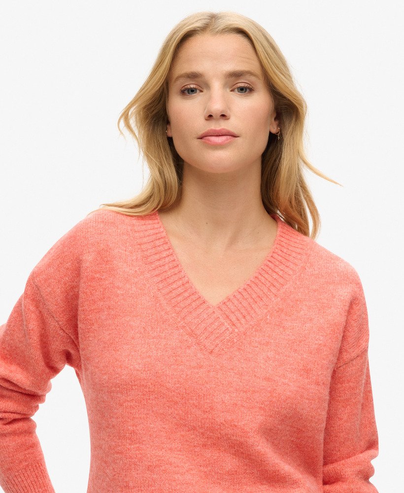 suéter oversized com decote em v na cor laranja mesclado.