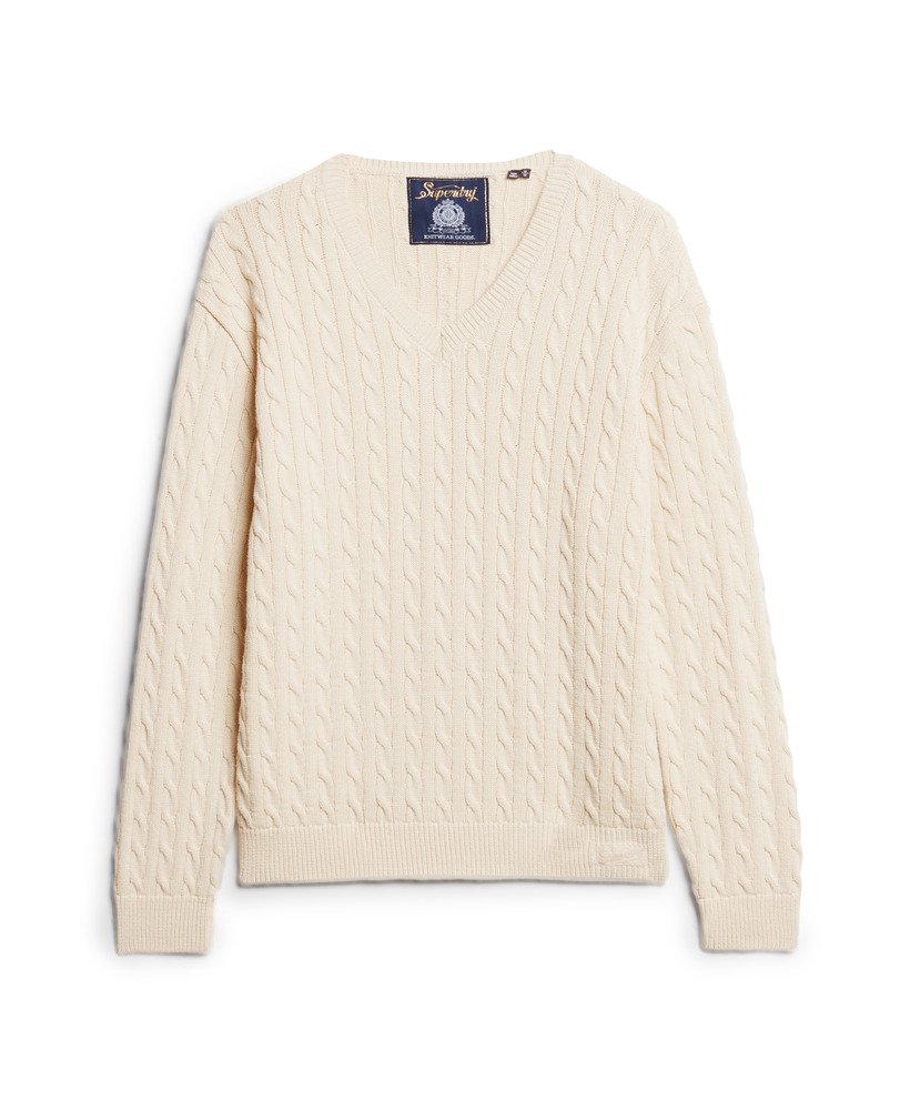 suéter oversized com decote em v e tranças na cor bege aveia.