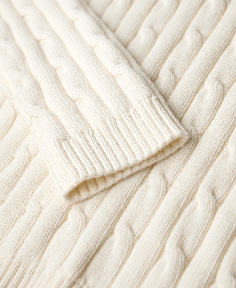 suéter vintage de tricô com ombros caídos na cor branco off-white.