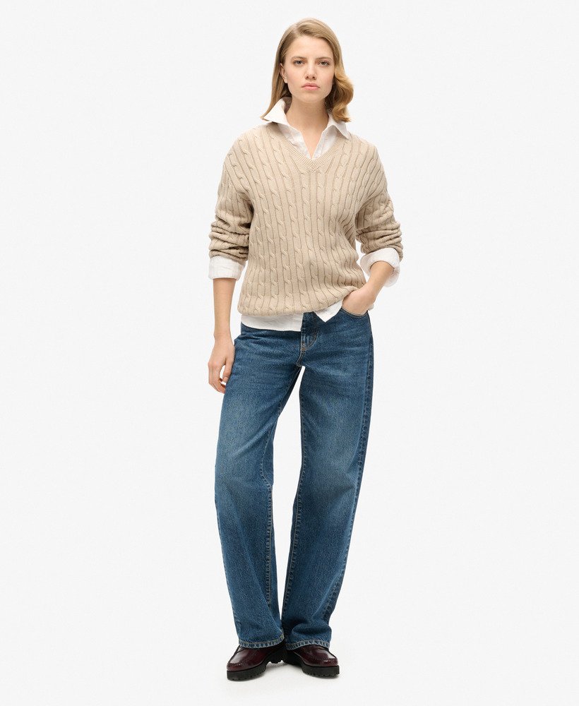 blusa oversized com decote em v e tranças na cor bege aveia.