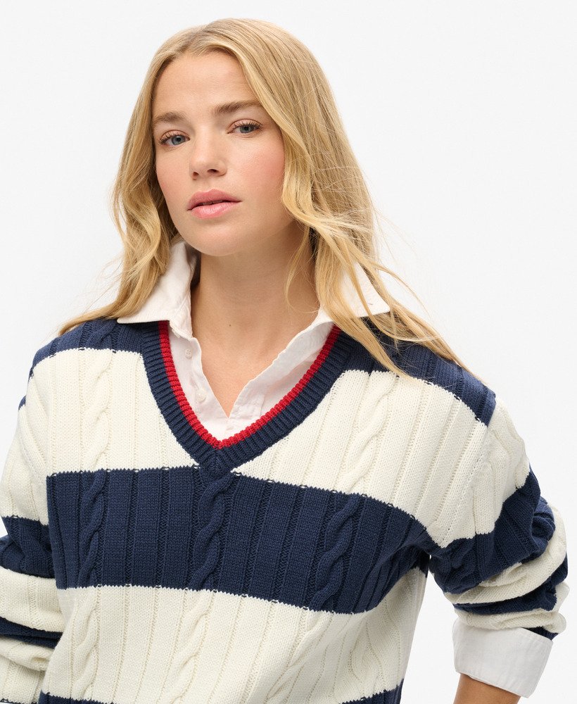 suéter oversized com decote em v e estampa de listras em azul marinho intenso.