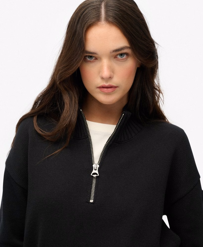Blusa de malha folgada com meio zíper