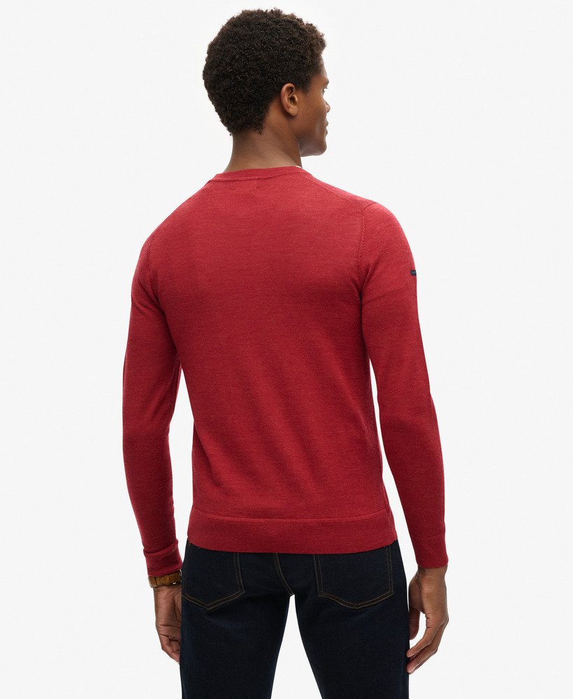 suéter de gola redonda em lã merino na cor vermelho mesclado.