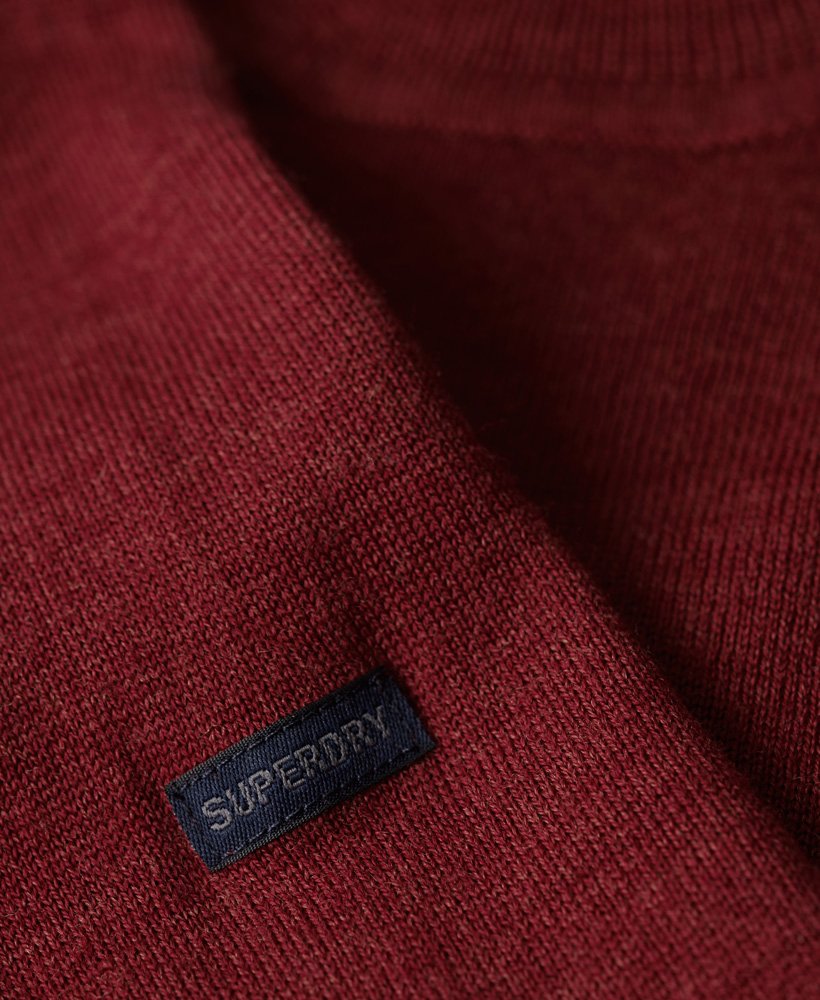 suéter de gola redonda em lã merino na cor vermelho mesclado.