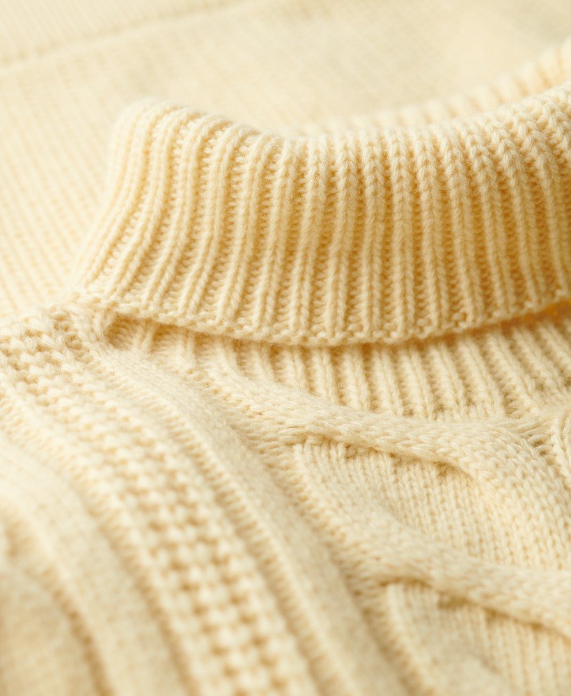 the merchant store - suéter de gola alta com tranças na cor branco off-white