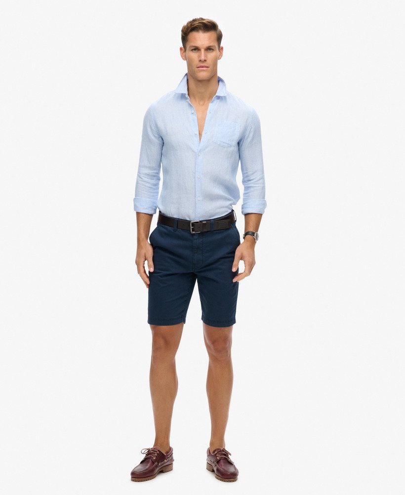 camisa de linho com botões da organic cotton studios em listras azuis estilo boné.
