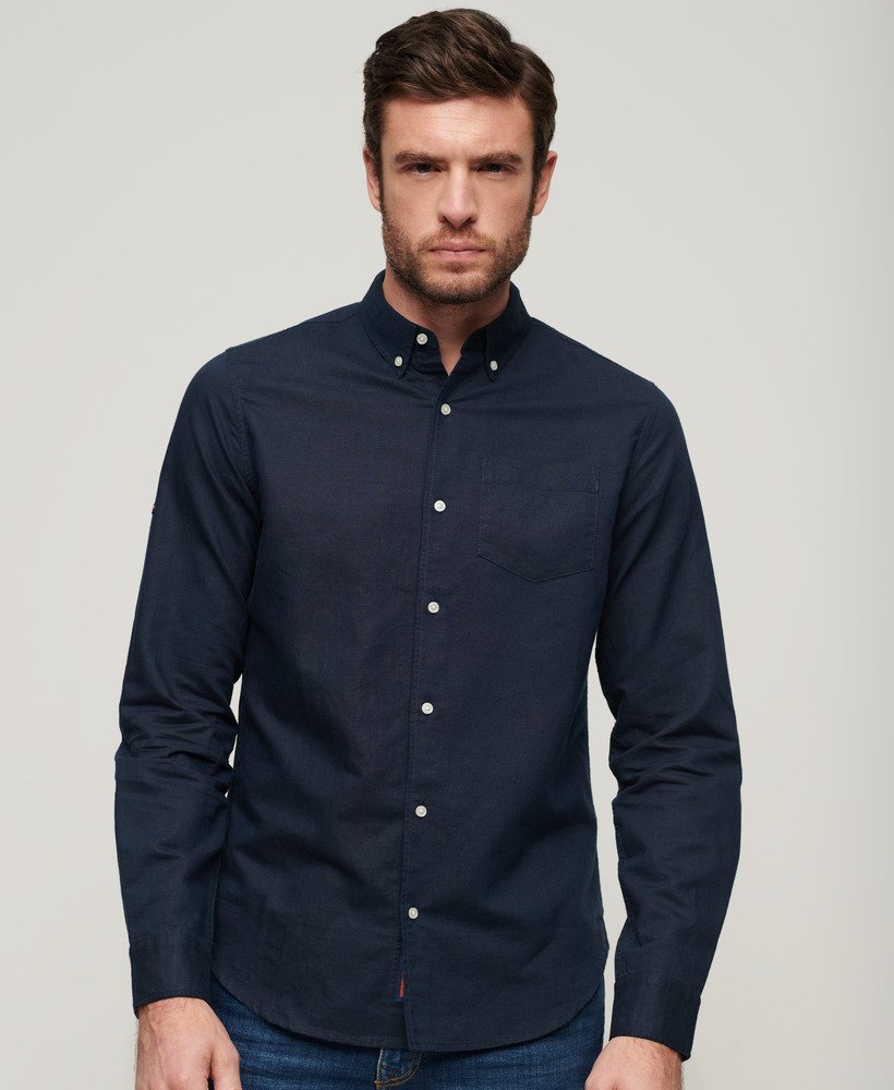 camisa de linho com botões da organic cotton studios na cor azul marinho eclipse.