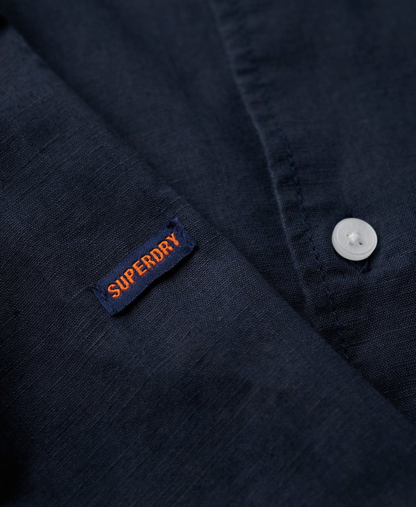 camisa de linho com botões da organic cotton studios na cor azul marinho eclipse.