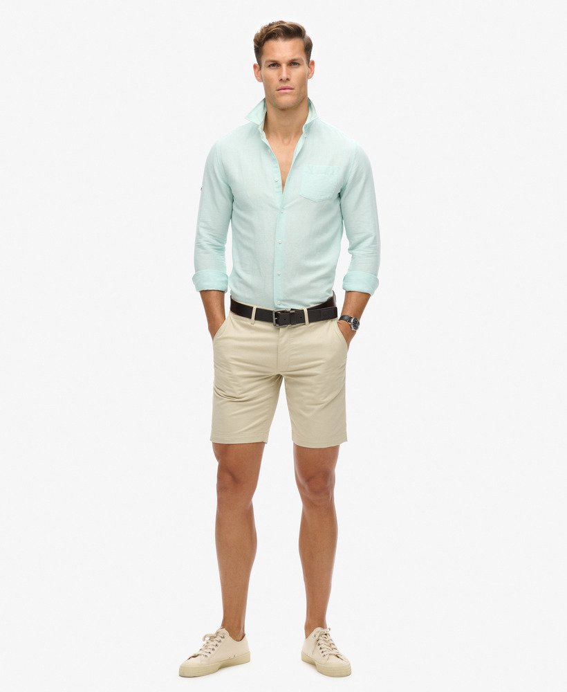 camisa de linho com botões da organic cotton studios na cor azul pluma.