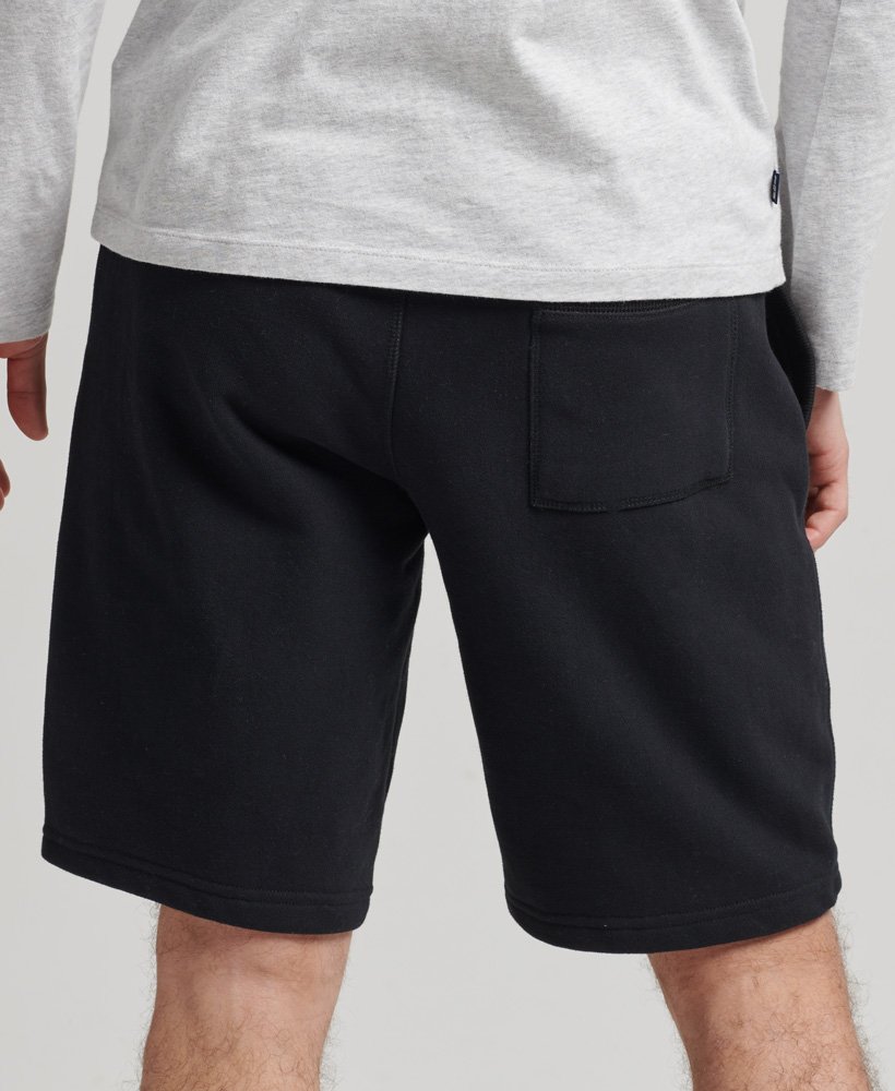 shorts de malha com logo vintage em algodão orgânico na cor preta.