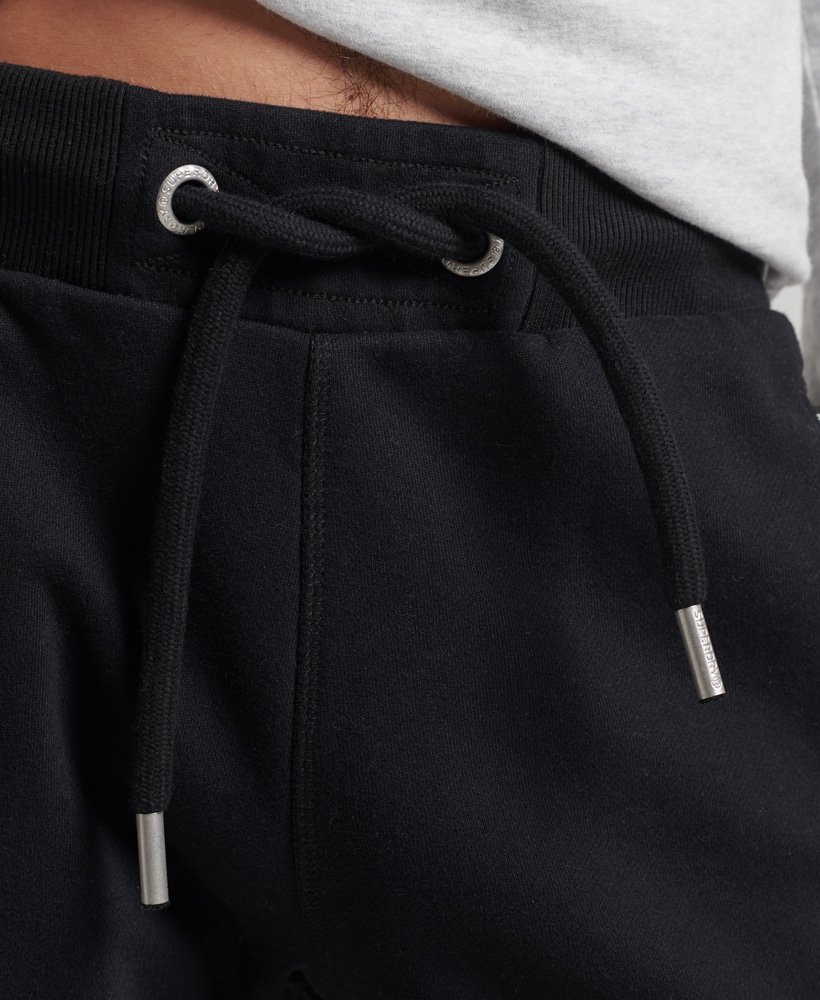 shorts de malha com logo vintage em algodão orgânico na cor preta.