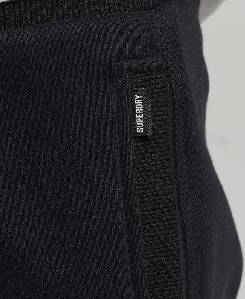 shorts de malha com logo vintage em algodão orgânico na cor preta.