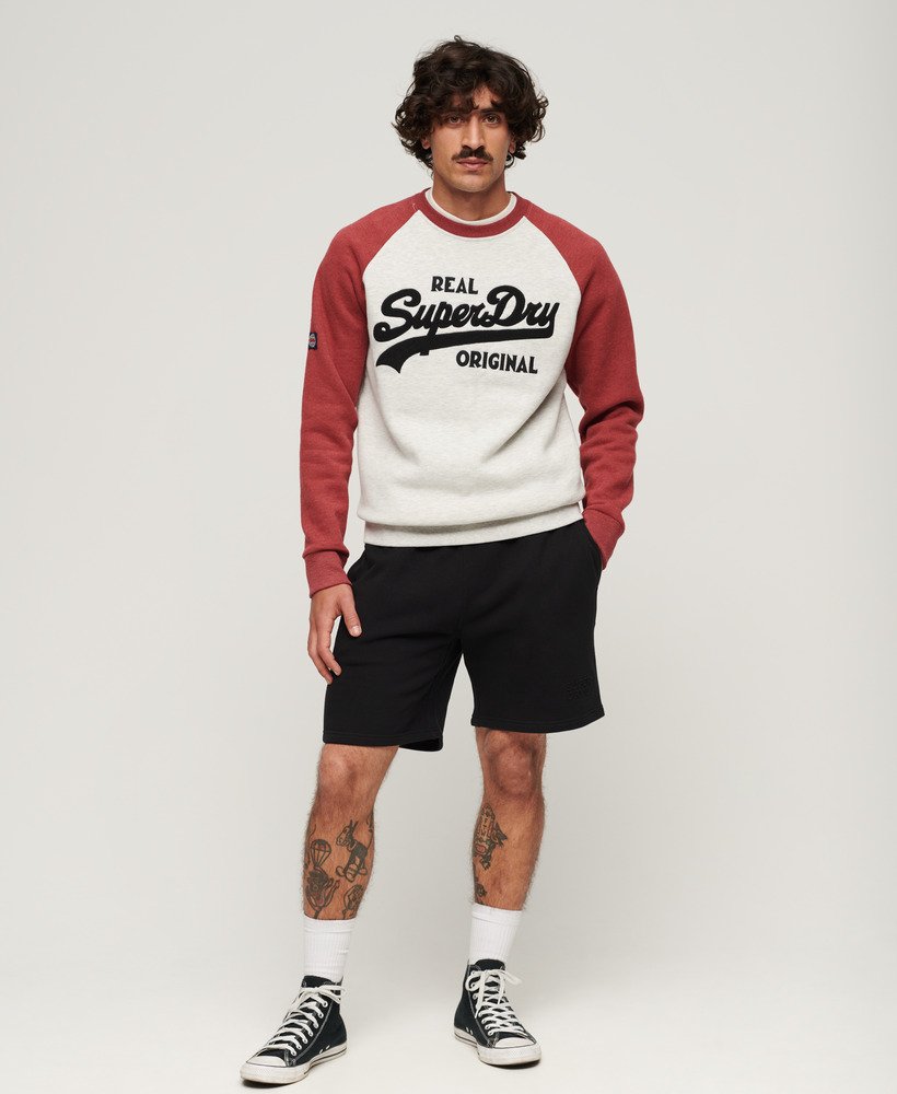 calções folgados com relevo da sportswear na cor preta.