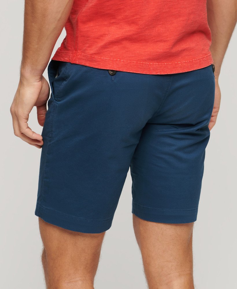 calções chino elásticos na cor azul médio da pilot.