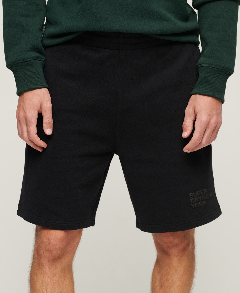 calções de luxo desportivos e folgados em preto.