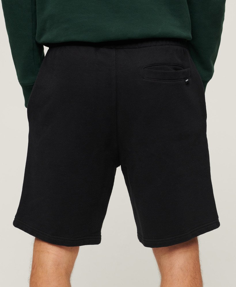 calções de luxo desportivos e folgados em preto.