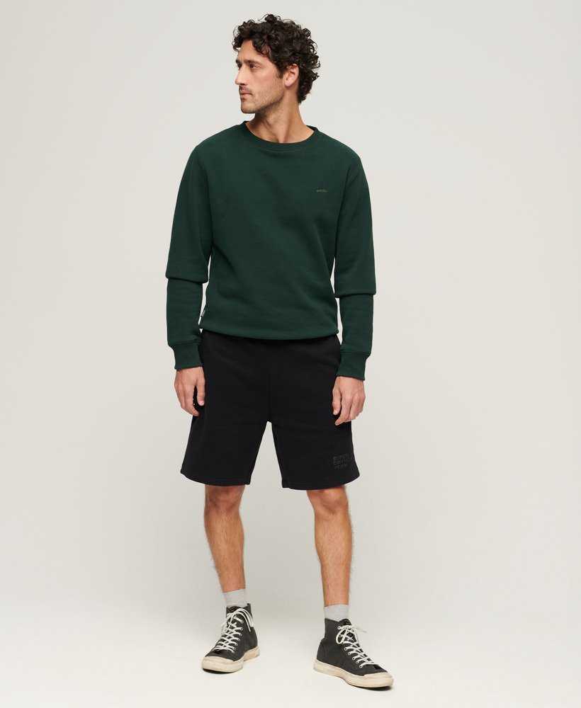 calções de luxo desportivos e folgados em preto.