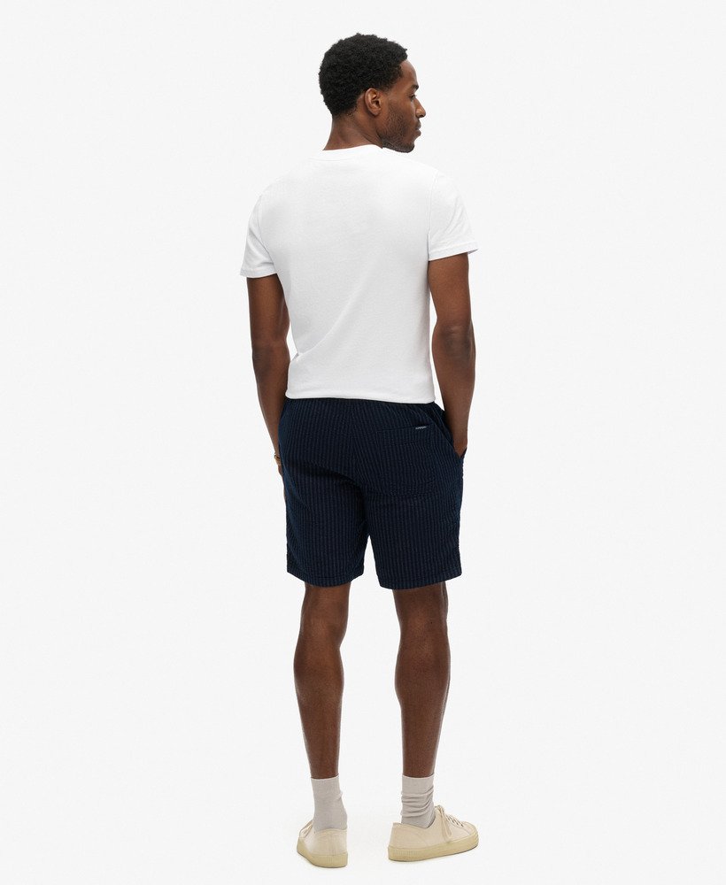bermuda indigo em tecido listrado duplo azul marinho