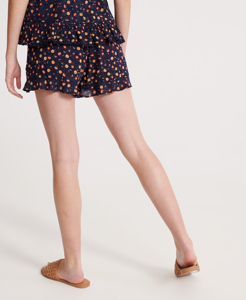 shorts de praia de verão com estampa floral azul-marinho.