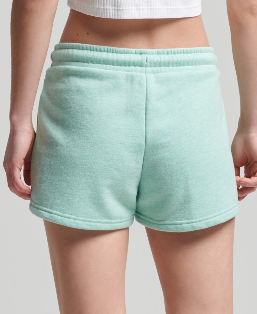 shorts de malha com logo vintage em algodão orgânico na cor verde menta mesclado.