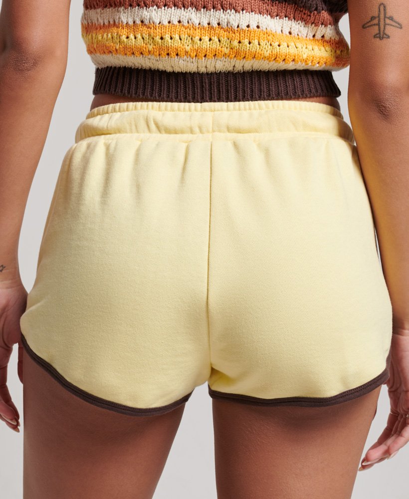 calções de corrida vintage em malha na cor amarelo claromarrom chocolate escuro